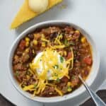 A nice big bowl of Southwest Chili with Black Beans and Corn is exactly what you need to warm you up on a cold, winter night | cookingwithcurls.com