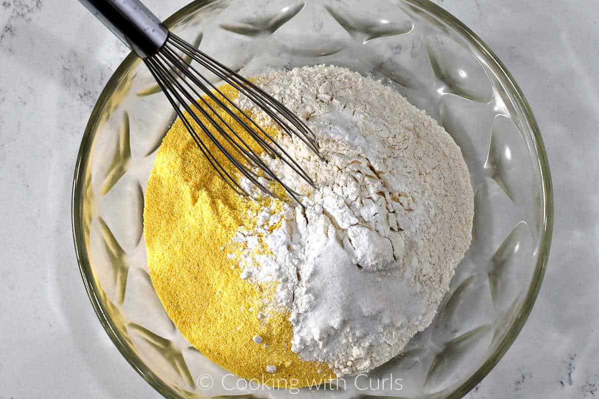 Yellow cornmeal, flour, baking powder, baking soda, and salt in a large mixing bowl.