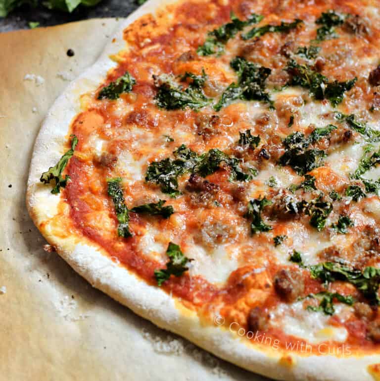 Sausage and Kale Pizza Cooking with Curls
