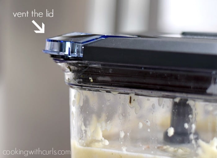 A close-up image of the vent flap on the blender lid.
