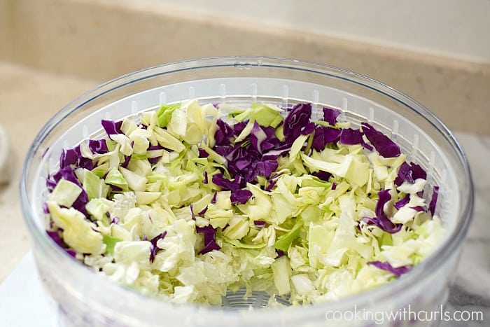 Chopped cabbage in a salad spinner.