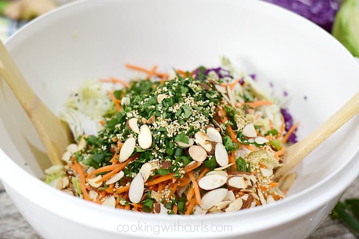 Whole30 Asian Sesame Chicken Salad tossed in a large bowl.