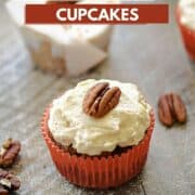 Paleo Maple Carrot Cupcakes in paper liners topped with maple frosting and pecan halves with title graphic across the top.