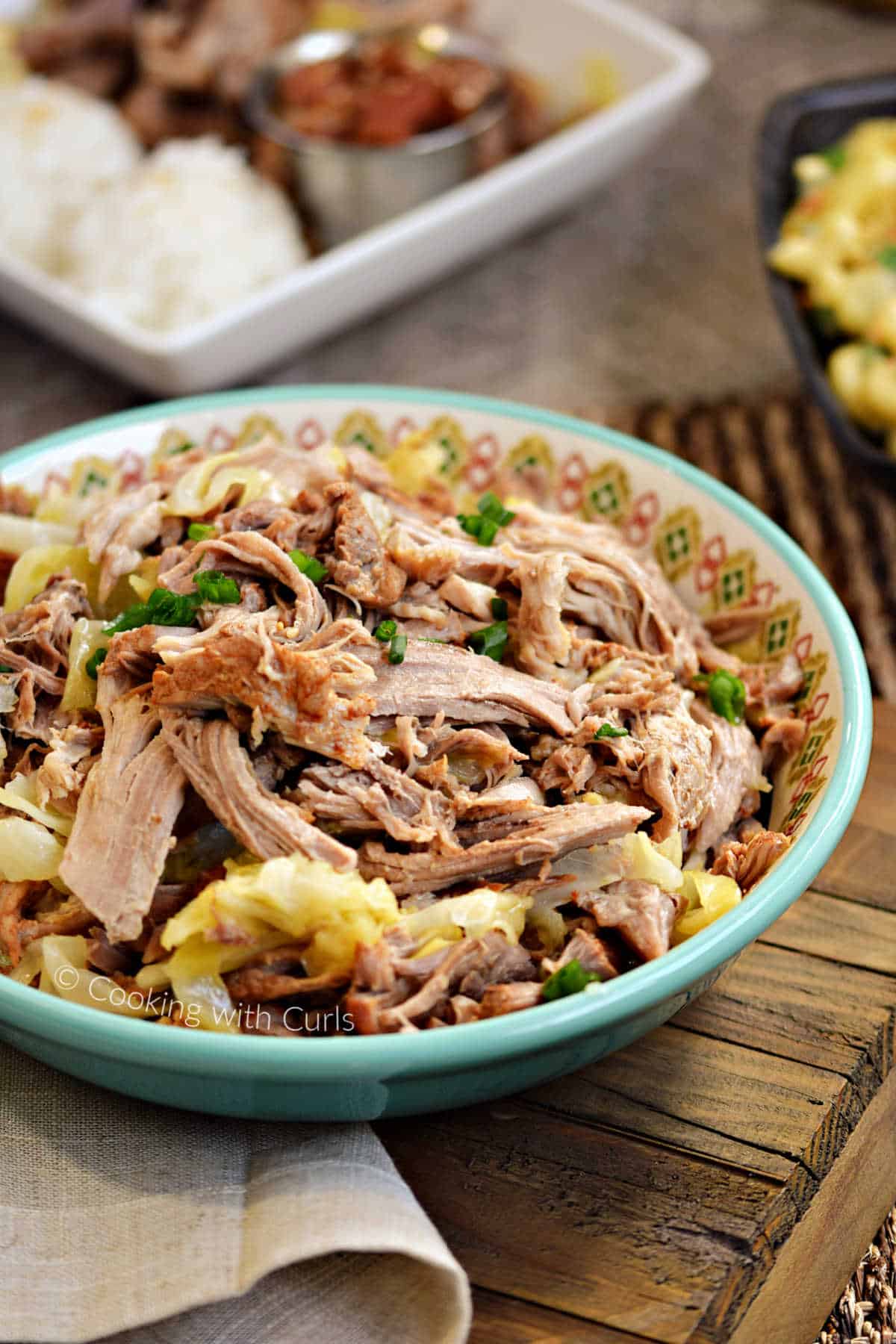 A bowl of shredded Instant Pot Kalua Pork with cabbage.