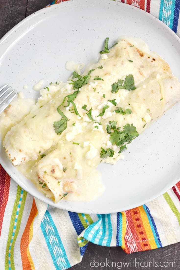 Msg 4 21+ Creamy Seafood Enchiladas are a decadent treat and perfect for celebrating Cinco de Mayo | cookingwithcurls.com #CervezaCelebration #ad