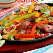 Strips of charred steak, bell peppers and onions in a fajita skillet surrounded by guacamole and salsa in small bowls with title graphic across the top.