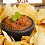 A small bowl of restaurant style blender salsa surrounded by tortilla chips with title graphic across the top.
