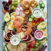 Smoked salmon breakfast platter with bagels, and toppings.