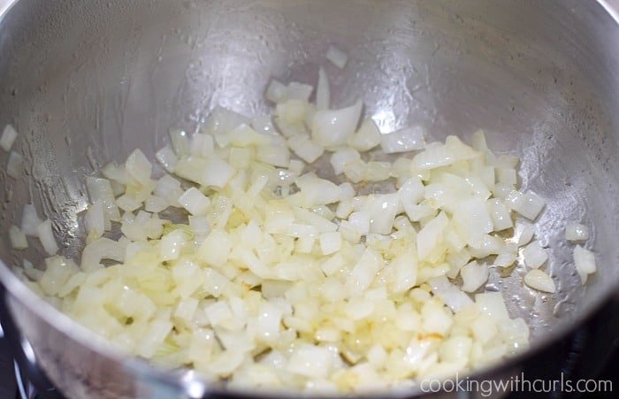 Sautéed chopped onions in a saucepan.