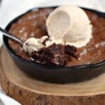 Grab two spoons and dive into this chewy and delicious Skillet Brownies for Two topped with a scoop of vanilla ice cream! cookingwithcurls.com