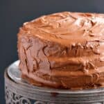Old-Fashioned Chocolate Fudge Cake on a crystal cake stand.