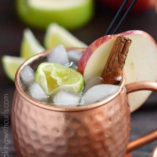 Celebrate the flavors of fall with a delicious Apple Cider Mule, complete with cinnamon sticks and apple slices | Copyright ® 2017 Cooking with Curls