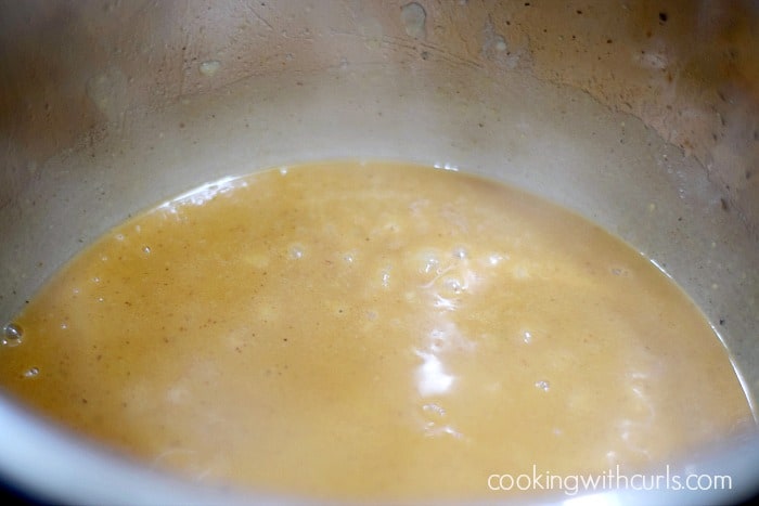 gravy simmering in an Instant Pot.