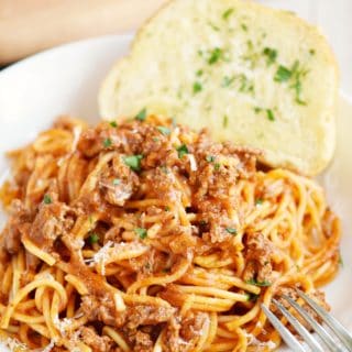 This Instant Pot Spaghetti is perfect for those nights when you need dinner fast! cookingwithcurls.com