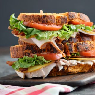Bacon Turkey Bravo Sandwich recipe on Tomato Basil Bread with crispy bacon, gouda cheese, sliced turkey, lettuce, and tomato | COPYRIGHT © 2017 COOKING WITH CURLS