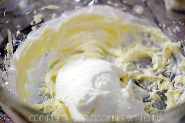 Butter and yogurt beaten together in a mixing bowl. 