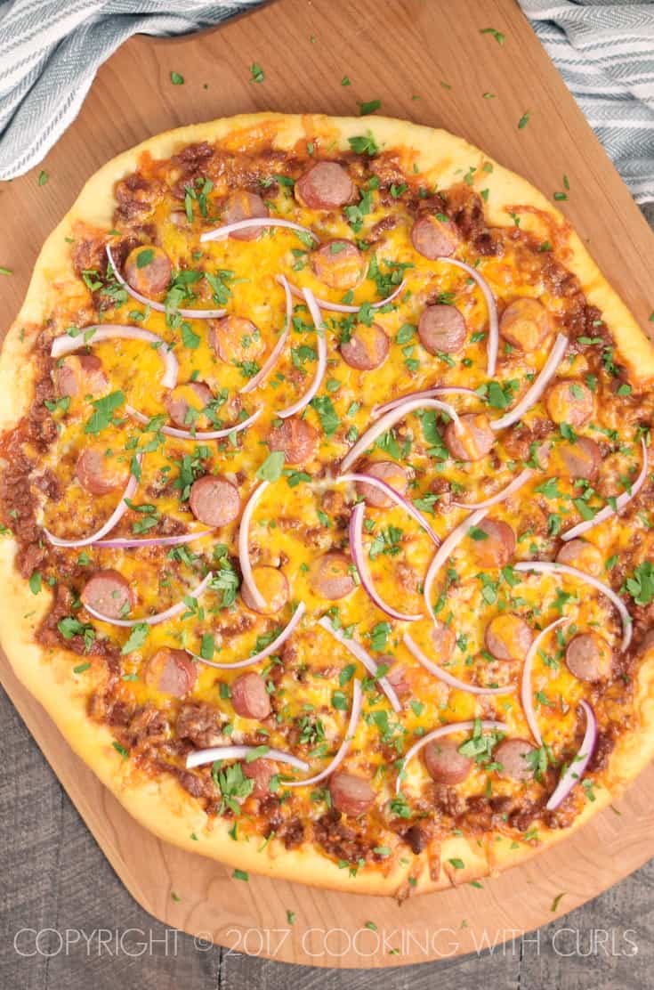 Chili Cheese Dog Pizza combines two of my favorite foods into one delicious pie that the whole family will enjoy! COPYRIGHT © 2017 COOKING WITH CURLS