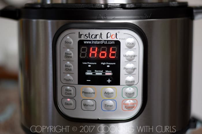 Instant Pot with HOT on the display.