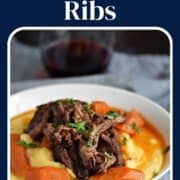 Short ribs and carrots on a bed of creamy polenta with wine gravy on top and title graphic across the top.