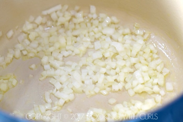 Chopped onions in a large Dutch oven.
