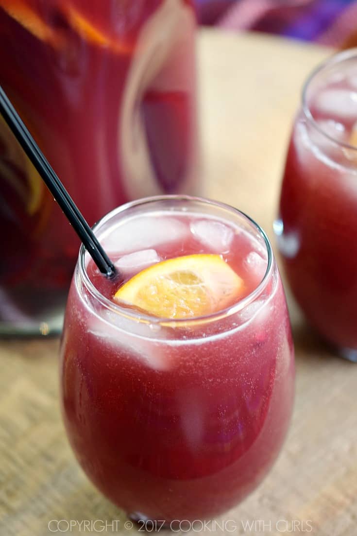 Pomegranate Orange Holiday Punch is a fruity, fizzy and delicious cocktail that your party guests will love! COPYRIGHT © 2017 COOKING WITH CURLS
