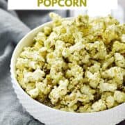 Green seasoned popcorn in a white bowl with title graphic across the top.