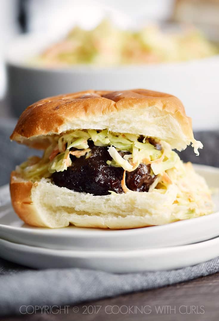 These Blackberry-Bourbon Burger Sliders are topped with Creamy Coleslaw and make the perfect appetizer for your next party! COPYRIGHT © 2017 COOKING WITH CURLS