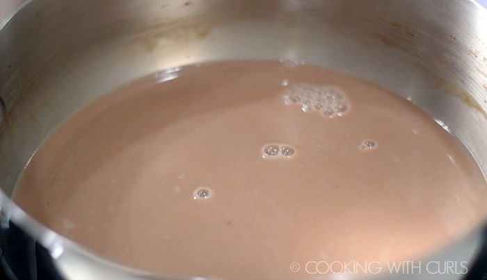 Milk, cocoa, and sugar in a sauce pan.