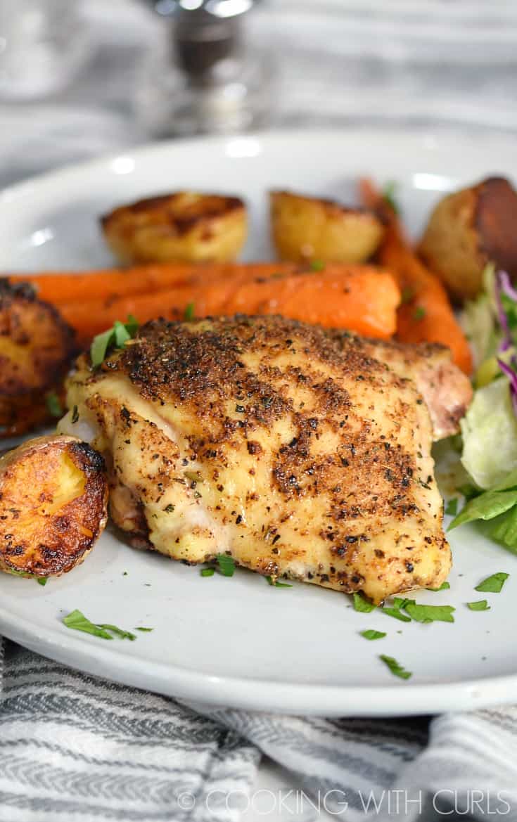 Sheet Pan Roast Chicken Thighs are baked with carrots and potatoes to golden perfection for a meal that the whole family will love! © 2017 COOKING WITH CURLS