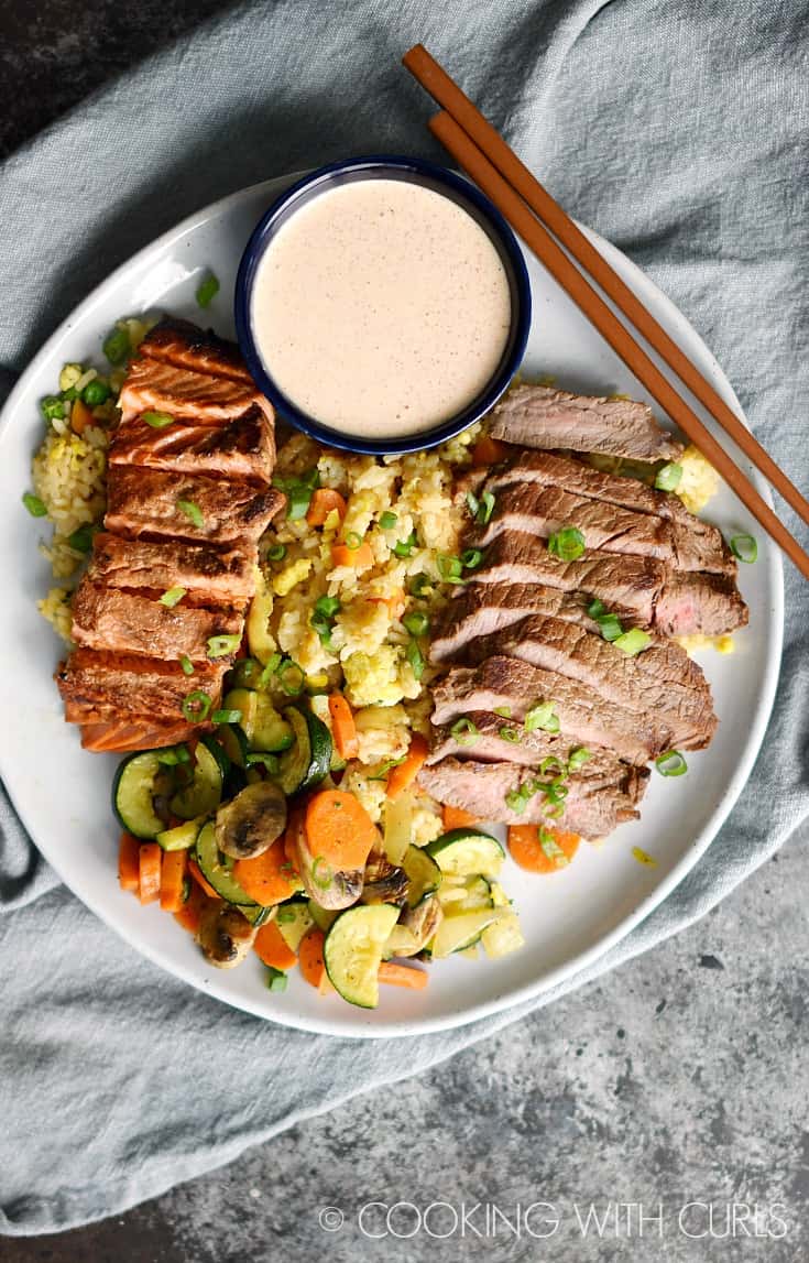 Japanese Hibachi Steak and Salmon served with fried rice, simple grilled vegetables, and yum yum sauce is the perfect date night meal! © COOKING WITH CURLS