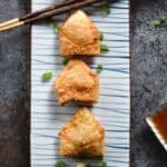 These Crispy Pork Wontons with Sweet and Sour Dipping Sauce are the perfect start to your meal or as a party appetizer! © COOKING WITH CURLS