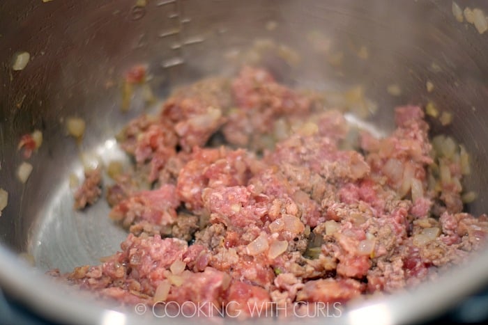 Brown the ground beef and Italian sausage