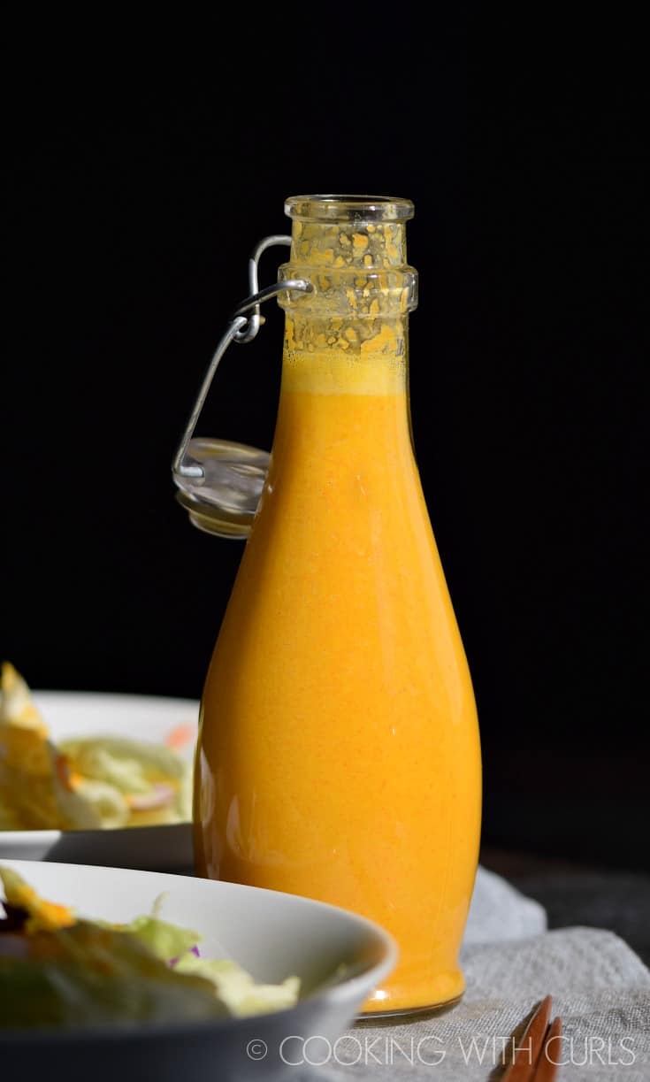 Carrot Ginger Miso Dressing in a glass bottle.