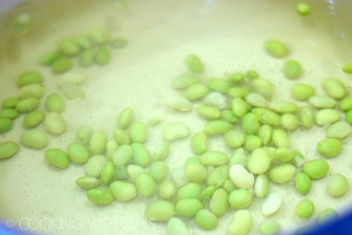 Edamame cooking in boiling water © COOKING WITH CURLS