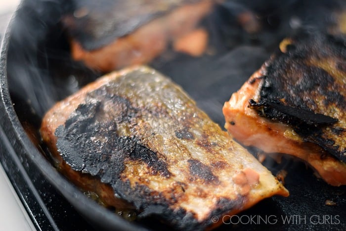 Flip the salmon over and cook on the other side © COOKING WITH CURLS