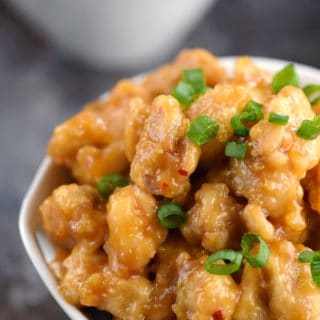 Impress your family with your mad skills and serve them Chinese Orange Chicken for dinner tonight! © COOKING WITH CURLS