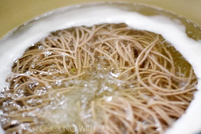 Soba noodles cooking in boiling water © COOKING WITH CURLS