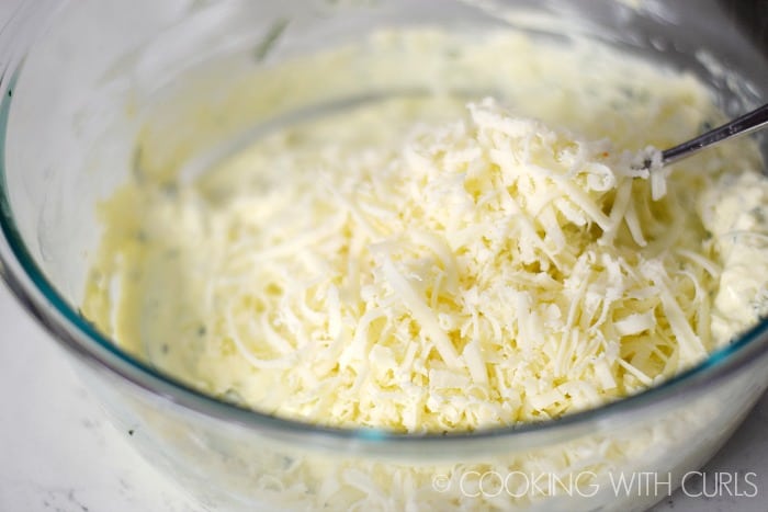Stir the mozzarella and Parmesan cheeses into the ricotta mixture