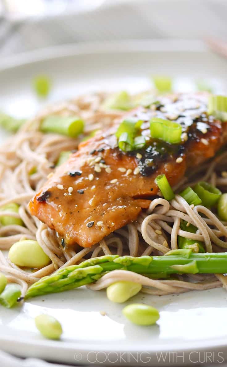 This Miso-Ginger Glazed Salmon is served on a bed of soba noodles that have been tossed with asparagus and edamame for a deliciously simple meal any night of the week! © COOKING WITH CURLS