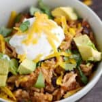 Your family will devour these Instant Pot Chicken Taco Bowls! © COOKING WITH CURLS