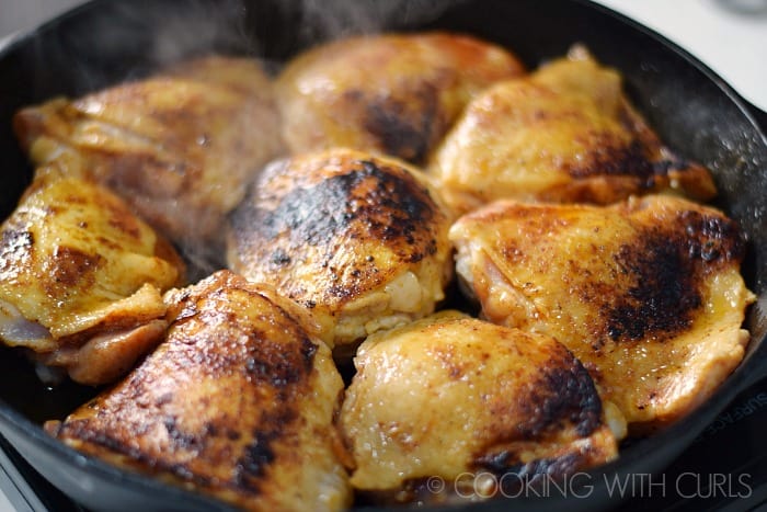 Chicken flipped over in the cast iron skillet to brown the other side © COOKING WITH CURLS