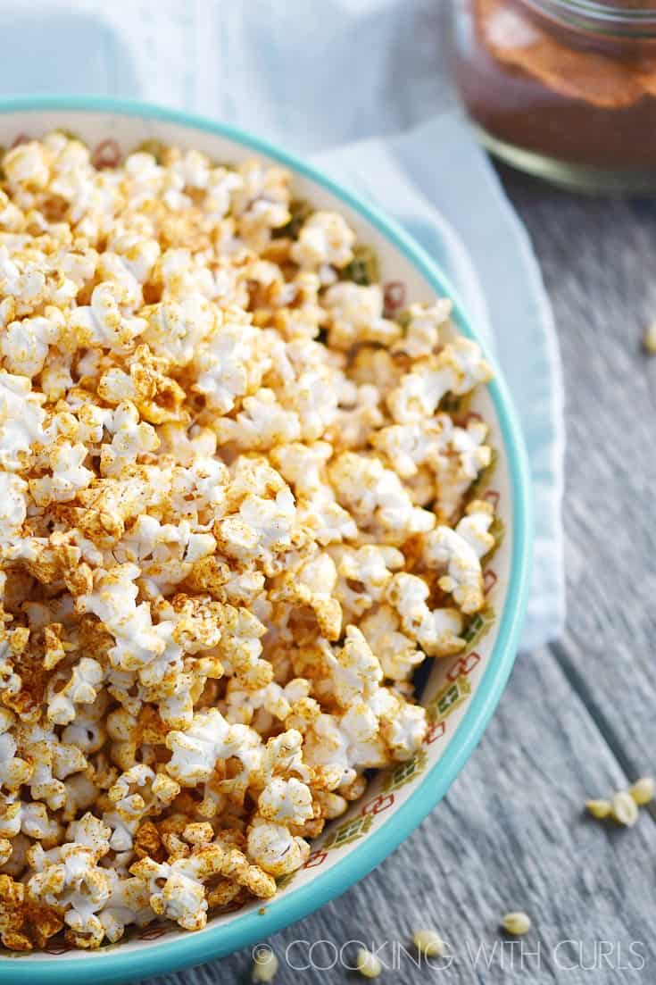 Taco Popcorn is a savory snack that your party guests and family will love! © COOKING WITH CURLS
