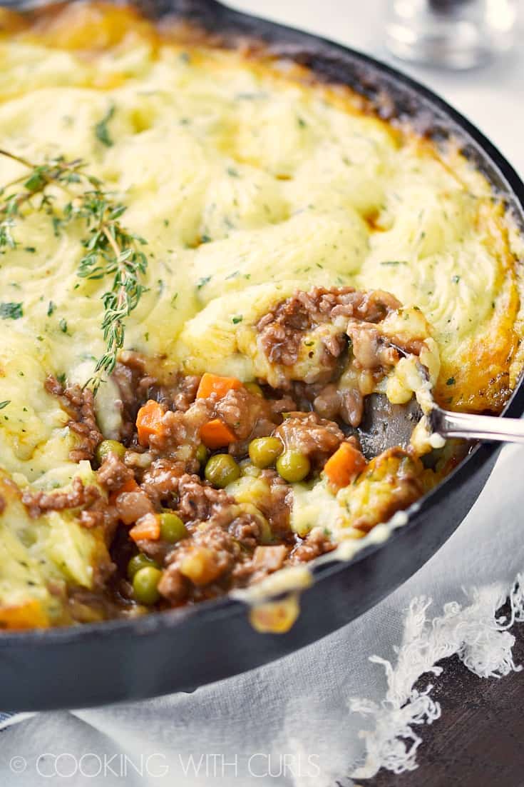 This Classic Shepherd's Pie recipe is made with lamb and topped with fluffy mashed potatoes! © COOKING WITH CURLS