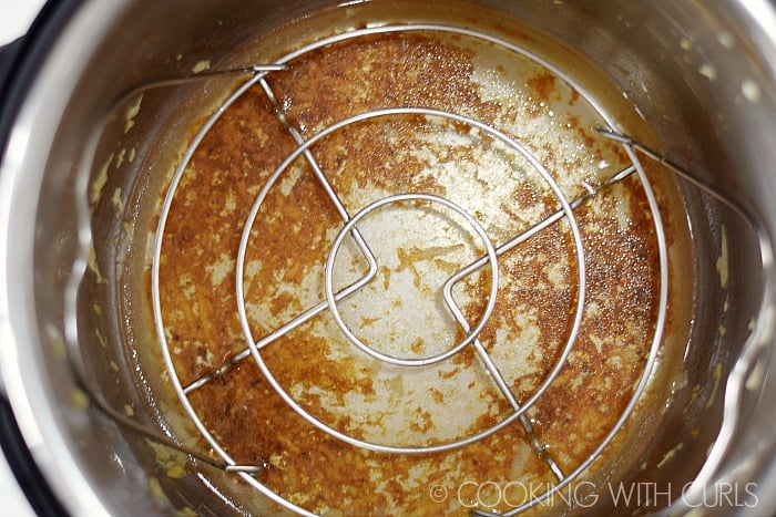 Add a trivet and water to the Instant Pot © COOKING WITH CURLS