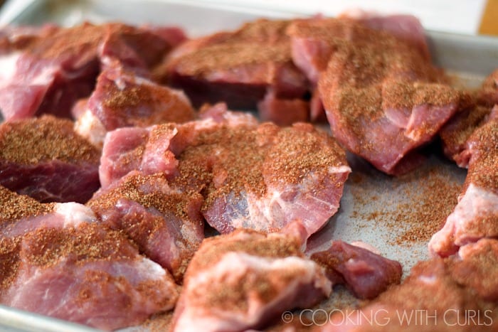 Chunks of pork butt rubbed with chipotle pepper and salt © COOKING WITH CURLS