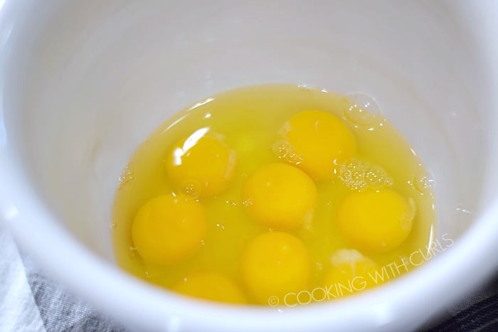 Eight large eggs in a white mixing bowl © COOKING WITH CURLS