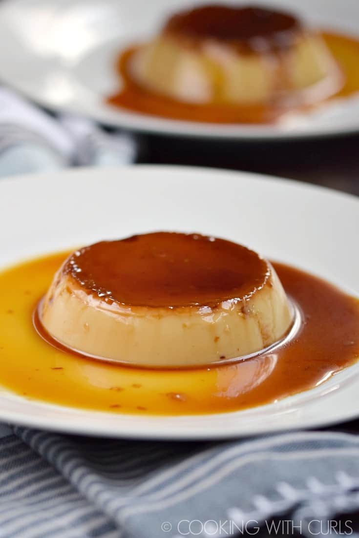 Kahlua Flan surrounded by caramel on a plate.