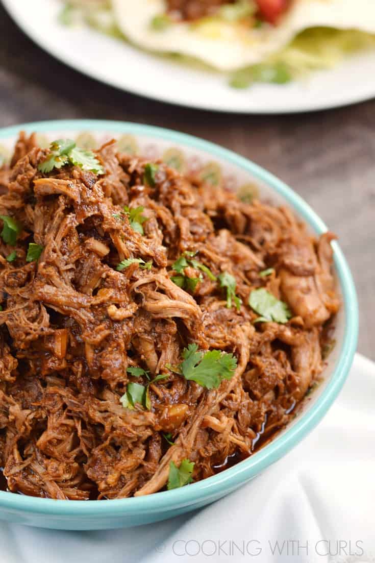 Instant Pot Red Chile Pork is a rich and tender filling for your soft tacos and tamales that will have your family asking for more! © COOKING WITH CURLS