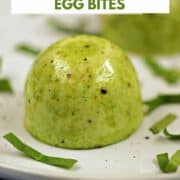 Two green spinach and cheese egg bites on a plate with title graphic across the top.