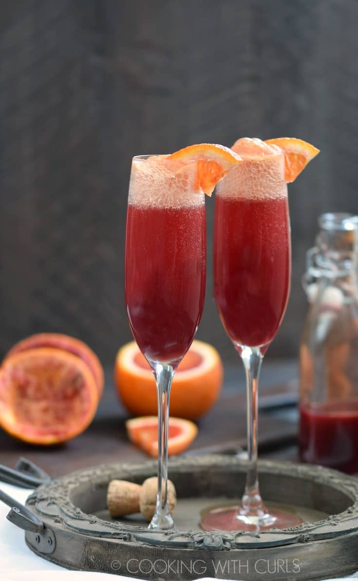 A Blood Orange Mimosa adds some sparkle and fizz to your brunch menu, and they are simple to make! © COOKING WITH CURLS